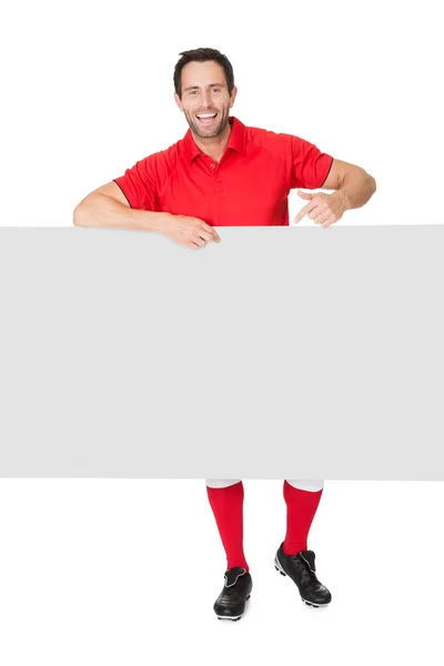 Портрет футболиста с пустым баннером — стоковое фото