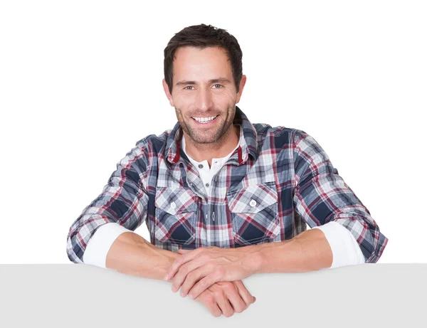 Happy middle age man presenting empty banner — Stock Photo, Image