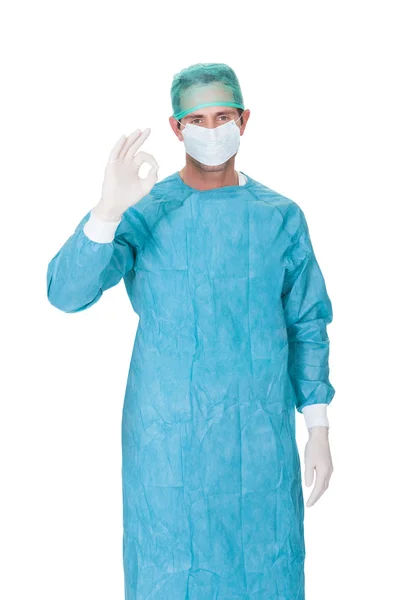 Male surgeon in scrubs uniform making Okay gesture — Stock Photo, Image