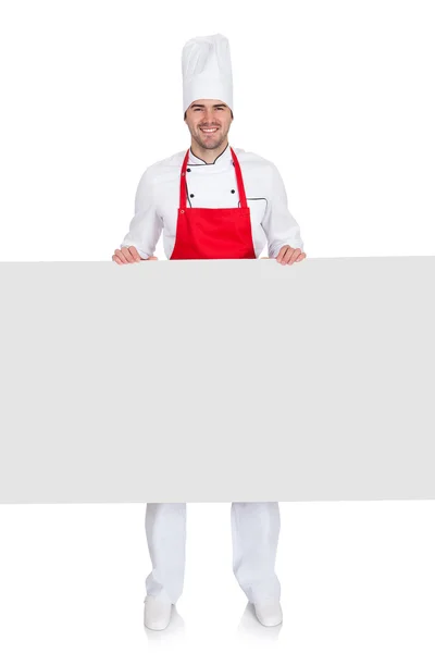 Chef-kok in uniform presentatie van lege banner — Stockfoto