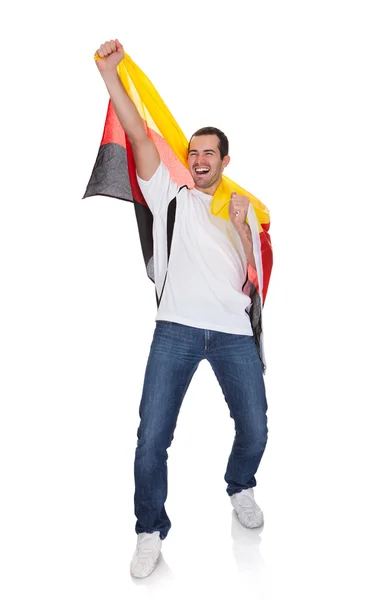 Retrato de un hombre feliz sosteniendo una bandera alemana — Foto de Stock