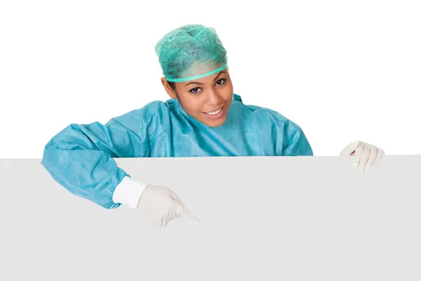 Happy Female Surgeon Holding Placard — Stock Photo, Image