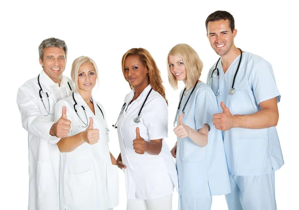 Grupo de médicos dando polegares para cima sinal sobre branco — Fotografia de Stock