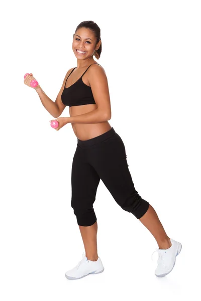 Portrait Of Excited Young Woman Jumping Stock Picture