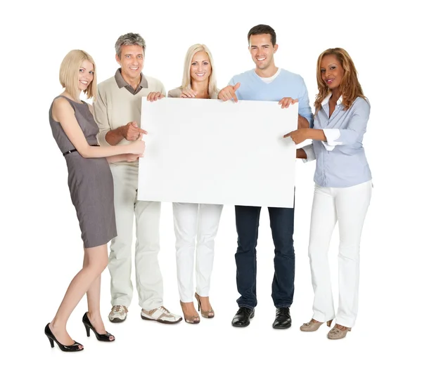 Businesspeople showing a blank board Royalty Free Stock Photos