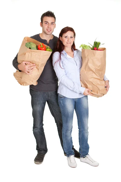 Casal feliz com sacos de compras de supermercado — Fotografia de Stock