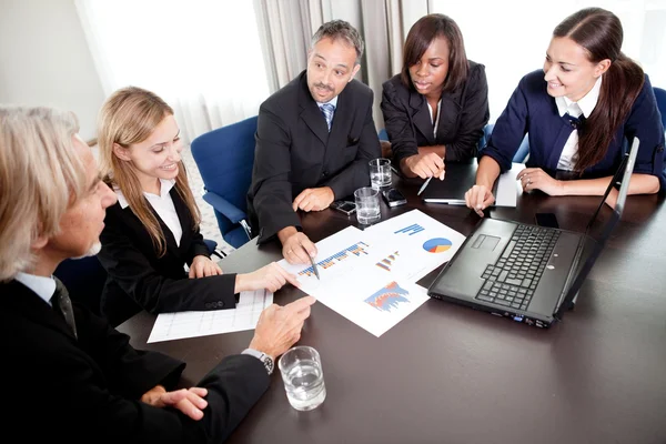 Young pretty females with mature business managers — Stock Photo, Image