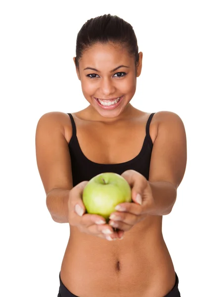 Щаслива жінка тримає зелене яблуко в руці — стокове фото