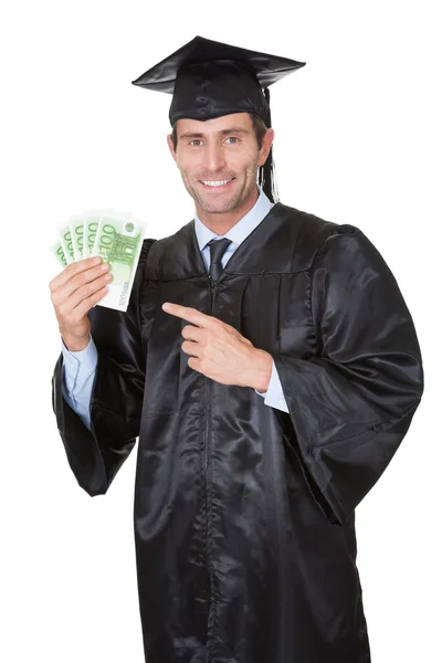 Retrato de estudiante graduado feliz con dinero en efectivo — Foto de Stock