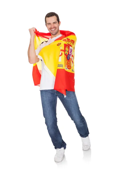 Portret szczęśliwy człowiek trzyma flagę Hiszpanii — Zdjęcie stockowe