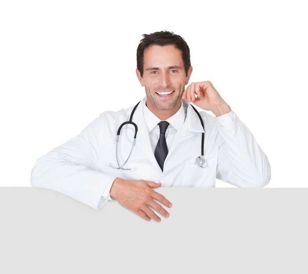 Doctor presenting empty banner — Stock Photo, Image