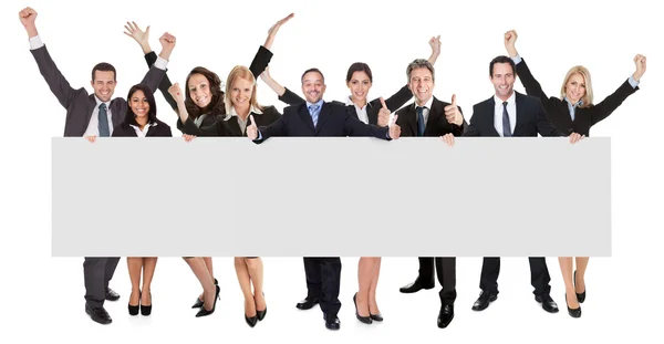 Excited business presenting empty banner — Stock Photo, Image
