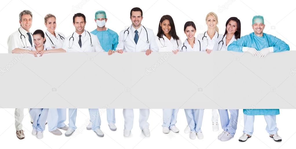 Group of doctors presenting empty banner