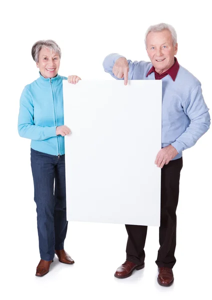 Senior Couple Holding Blank Placard — Stock Photo, Image