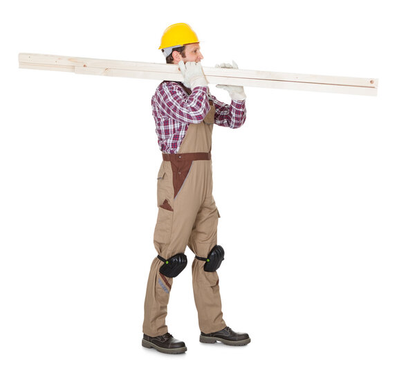 Carpenter with wooden planks