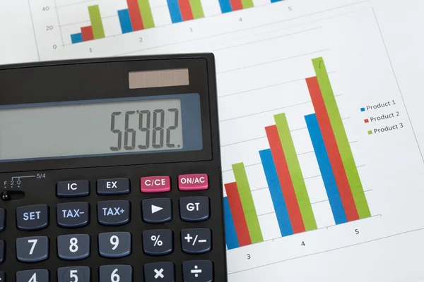 A számológép és növekedési táblázatok fénykép — Stock Fotó