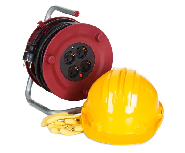 Electric cable reel, helmet and rubber gloves — Stock Photo, Image