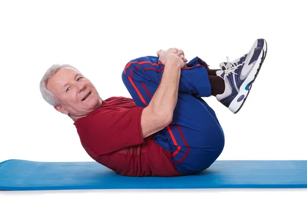 Portrét cvičícího staršího muže — Stock fotografie