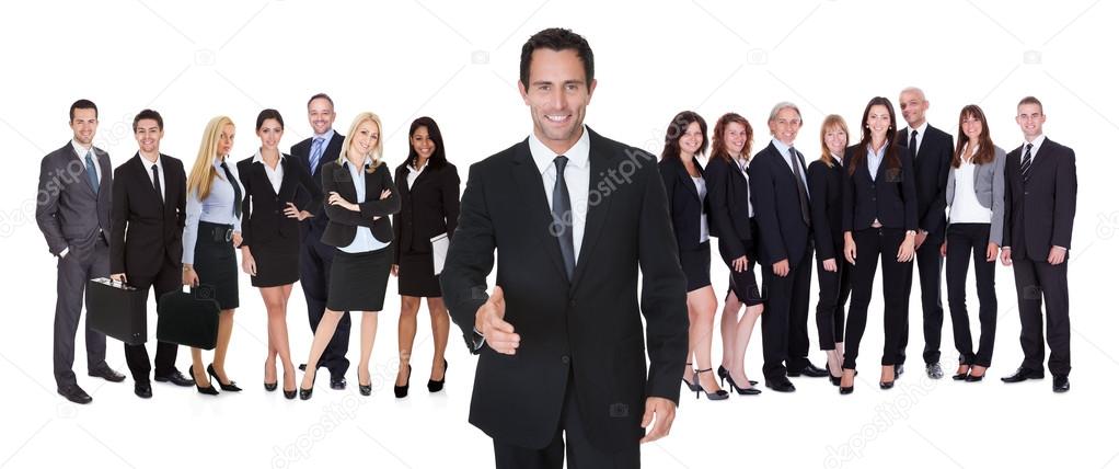 Portrait of happy businessman and his team