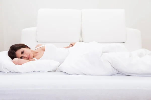 Young Woman Sleeping On The Bed — Stock Photo, Image