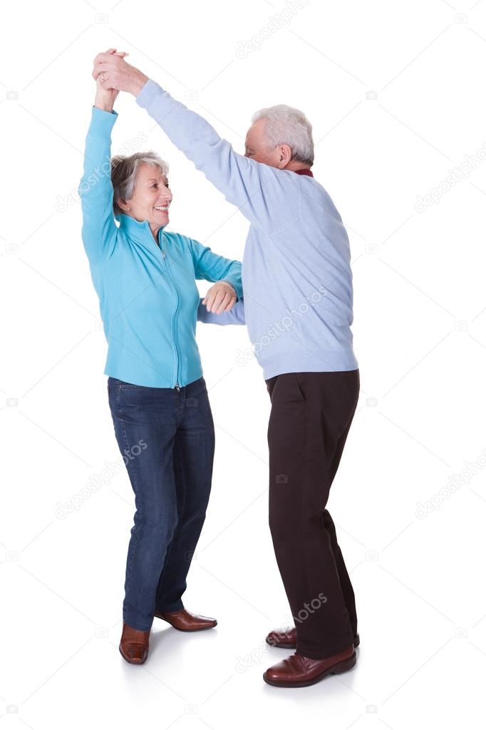 Portrait Of Senior Couple Dancing