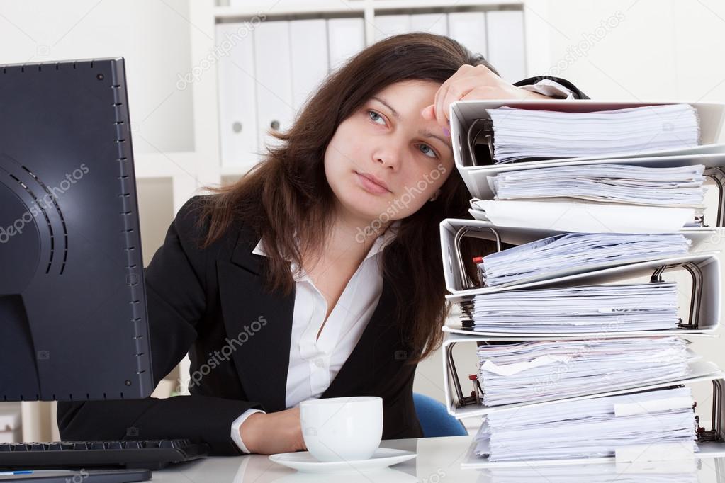 Stressed Woman Working In Office
