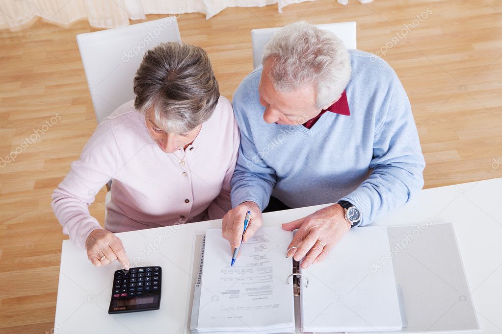 Senior Couple Calculating Budget