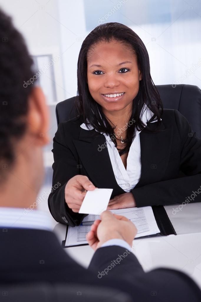 Businesspeople Exchanging Visiting Card