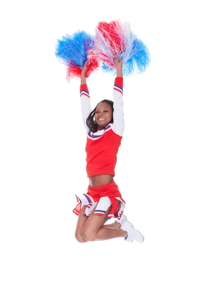 Sorridente bella cheerleader con pompon . — Foto Stock