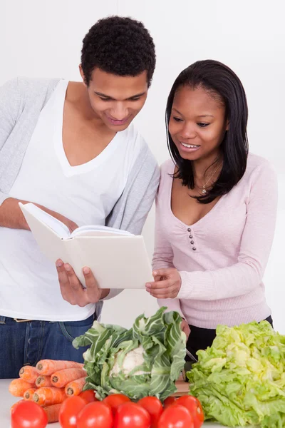 Couple Reading The Book Of Recipes — Stock Photo, Image