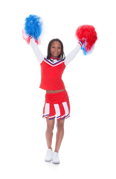 Sorridente bella cheerleader con pompon . — Foto Stock