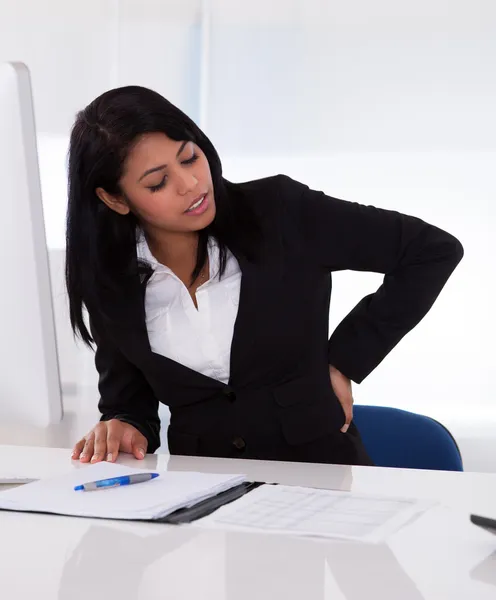 Businesswoman In Pain Holding Her Back — Stock Photo, Image