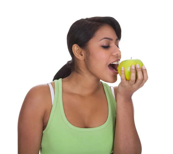 Young Woman Eating Apple Royalty Free Stock Photos