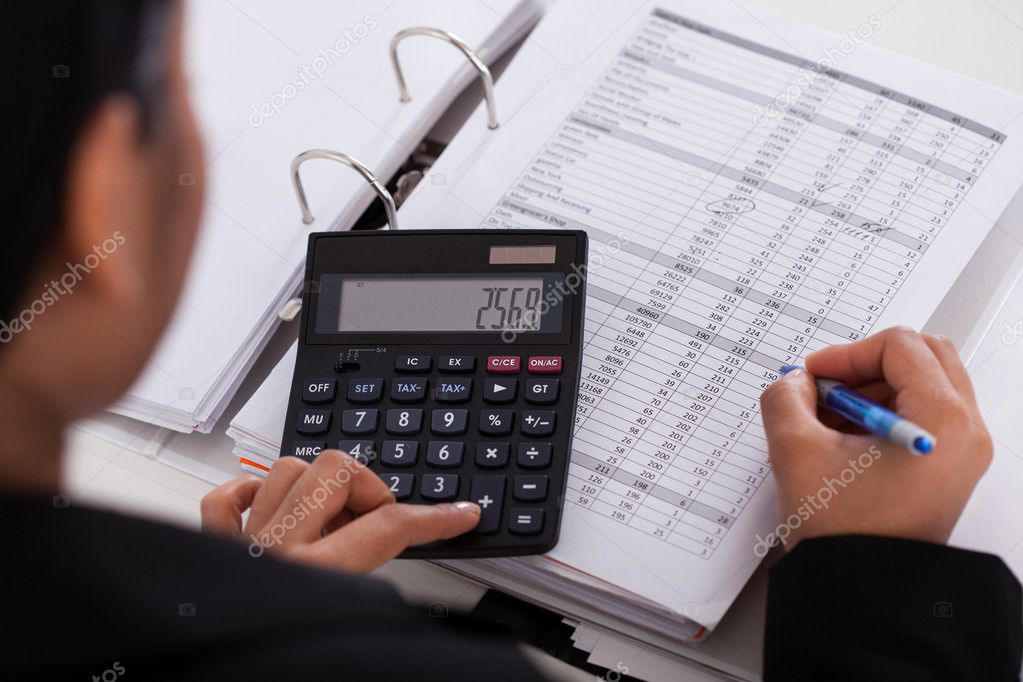 Businesswoman Doing Calculations