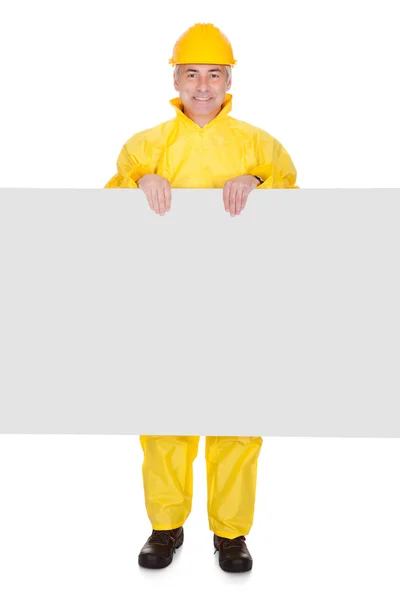 Mature Man Wearing Raincoat And Standing Behind Placard — Stock Photo, Image