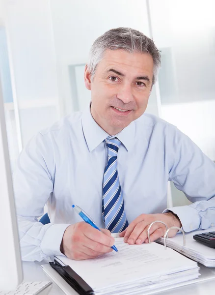 Mature Businessman At Work Stock Picture