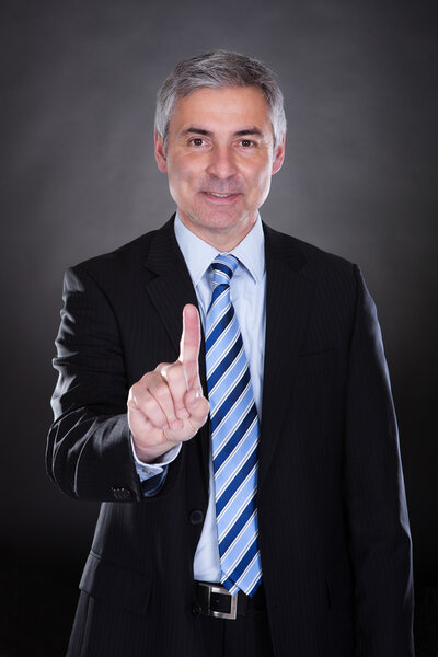 Businessman touching the screen