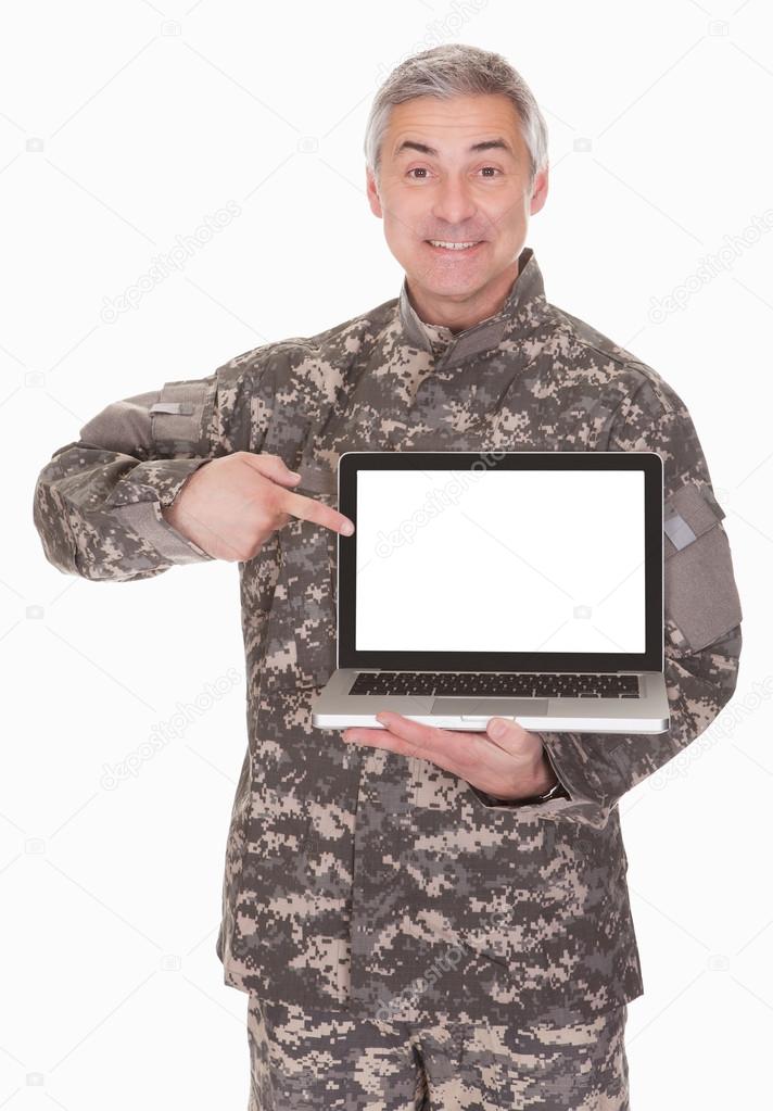 Mature Soldier Showing Laptop