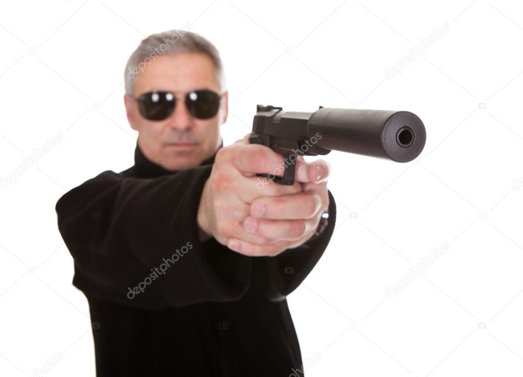 Mature Man Aiming With Handgun