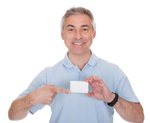 Hombre sosteniendo la tarjeta de visita en blanco —  Fotos de Stock