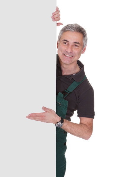 Mature Male Gardner Holding Placard