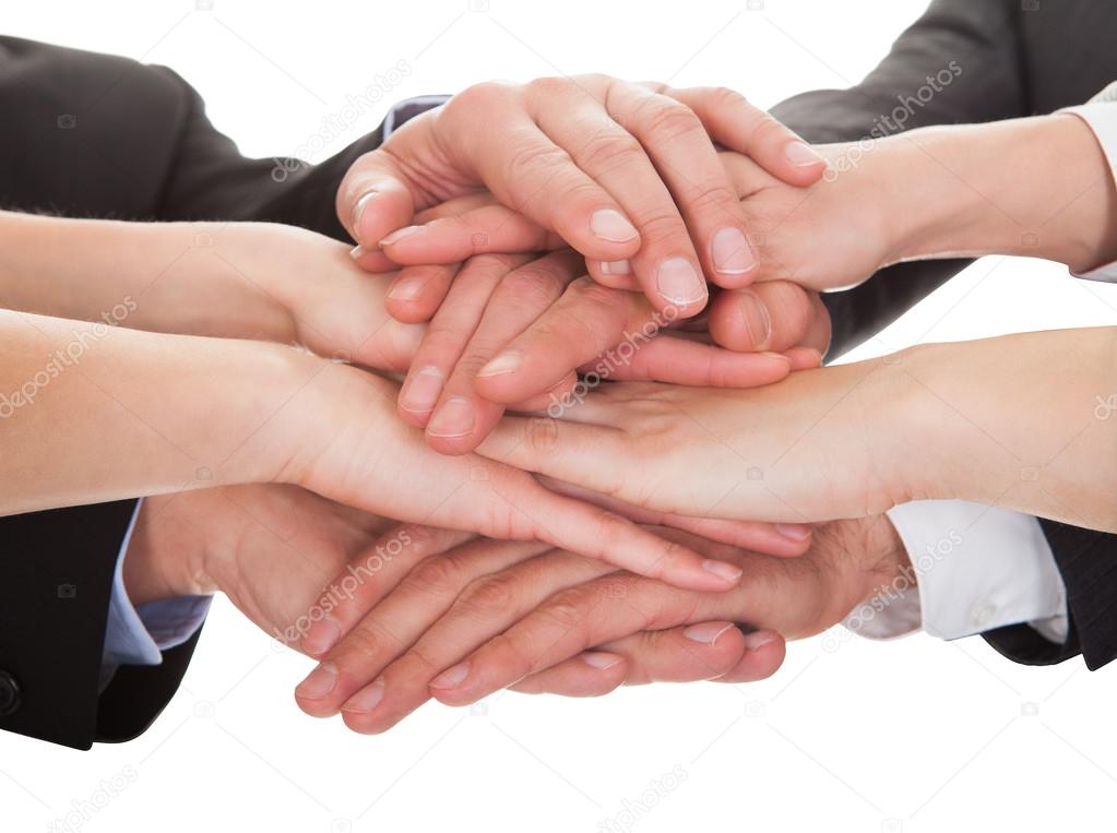 Businesspeople Stacking Their Hands Together