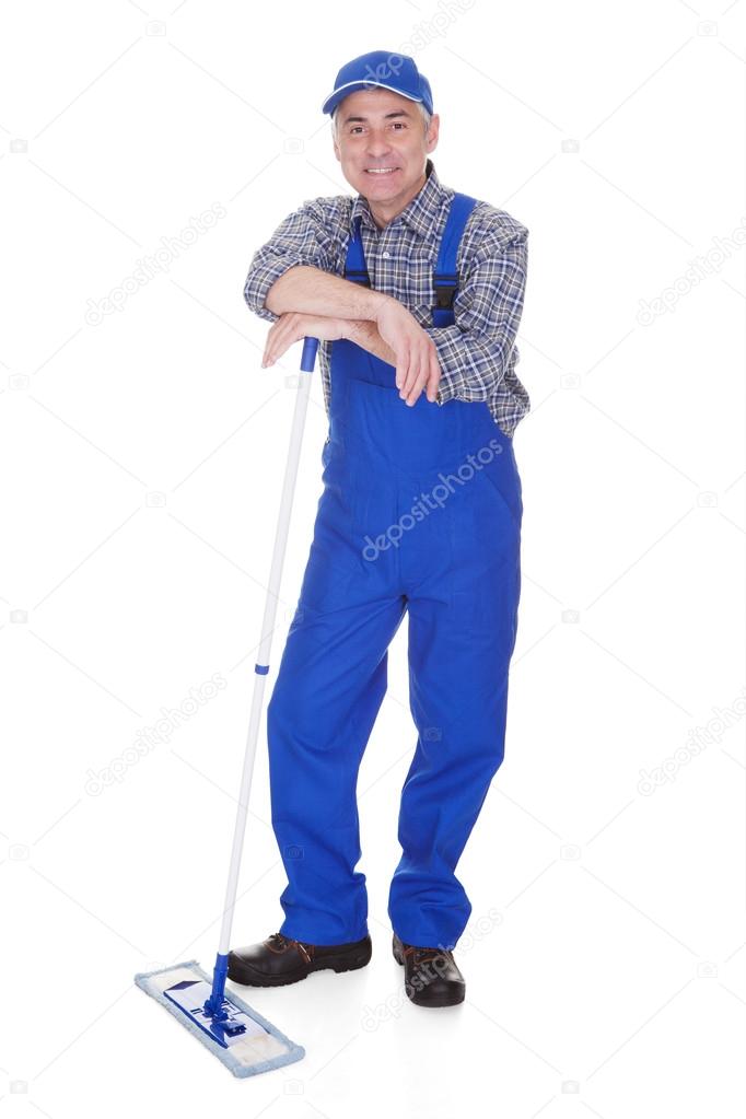 Mature Man Cleaning Floor With Mop