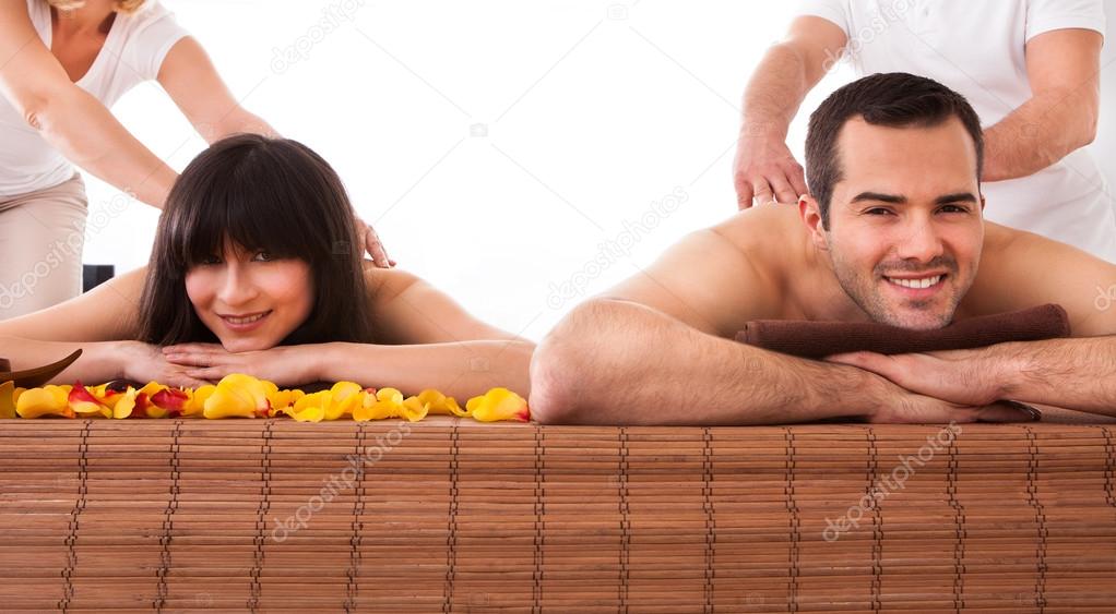 Beautiful Young Couple Enjoying Massage