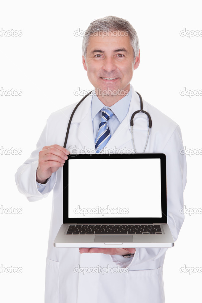 Portrait Of Male Doctor Showing Laptop