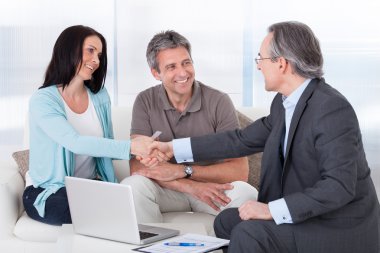 Consultant Shaking Hand With Woman clipart