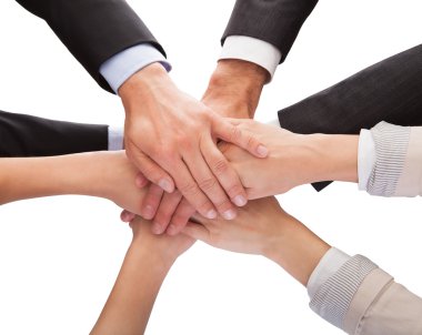 Businesspeople Stacking Their Hands Together clipart