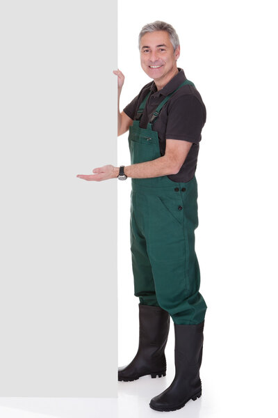Mature Male Gardner Holding Placard