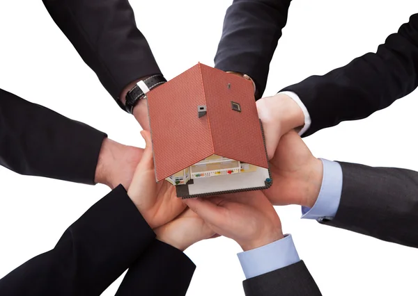 Group Of Businesspeople Holding Model House — Stock Photo, Image