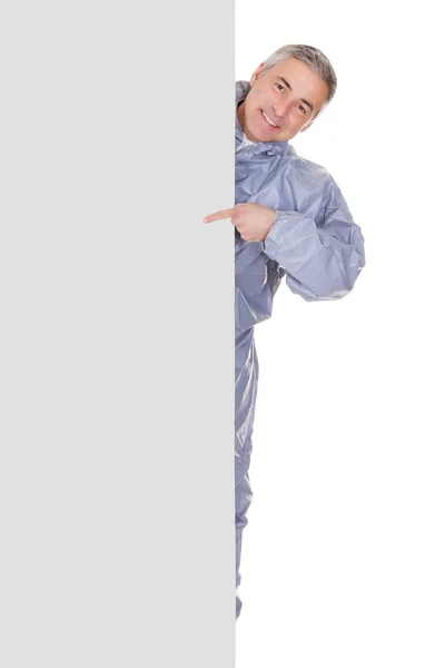 Mature Man Pointing At Blank Placard — Stock Photo, Image
